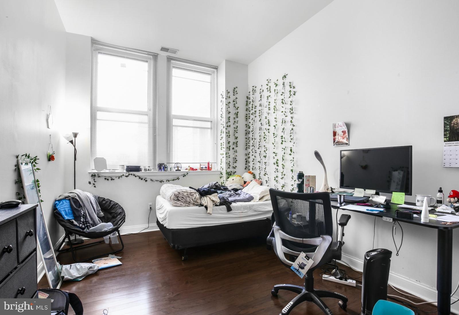 1001 Chestnut Street, Unit 903W Philadelphia, PA 19103 - Photo 10 of 21 a living room with furniture and a flat screen tv