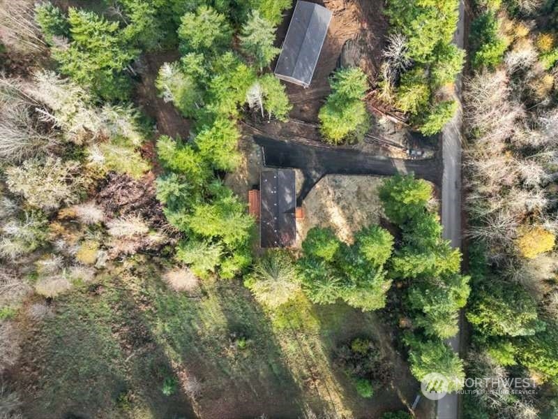 670 East Wilson Way Grapeview, WA 98546 - Photo 16 of 36 a backyard of a house with lots of green space