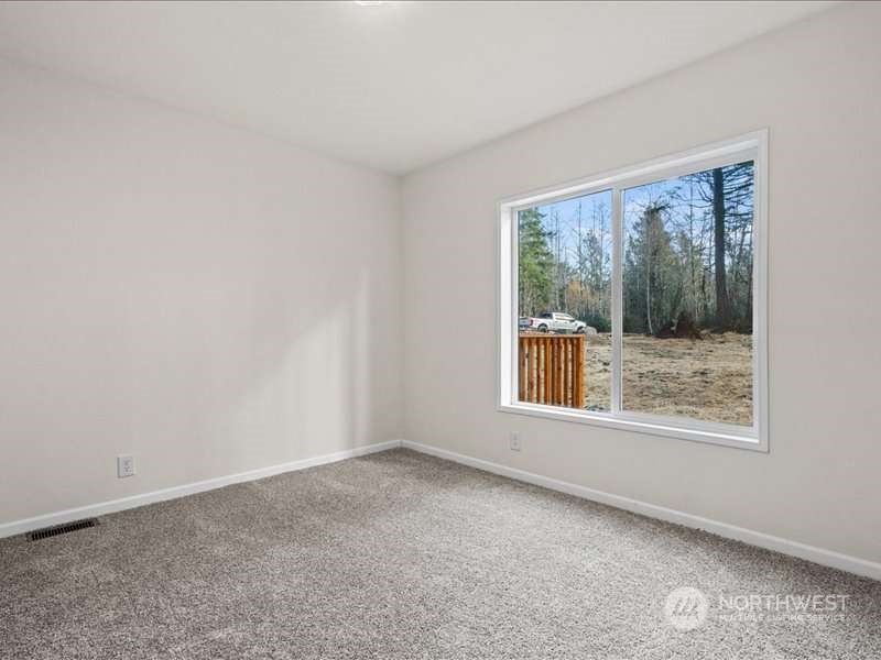 670 East Wilson Way Grapeview, WA 98546 - Photo 26 of 36 an empty room with a window