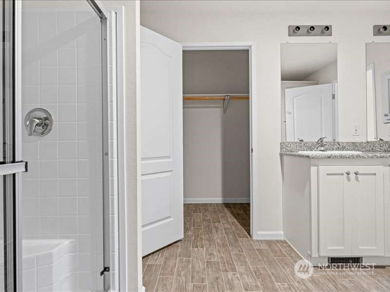 670 East Wilson Way Grapeview, WA 98546 - Photo 28 of 36 a view of a hallway with wooden floor
