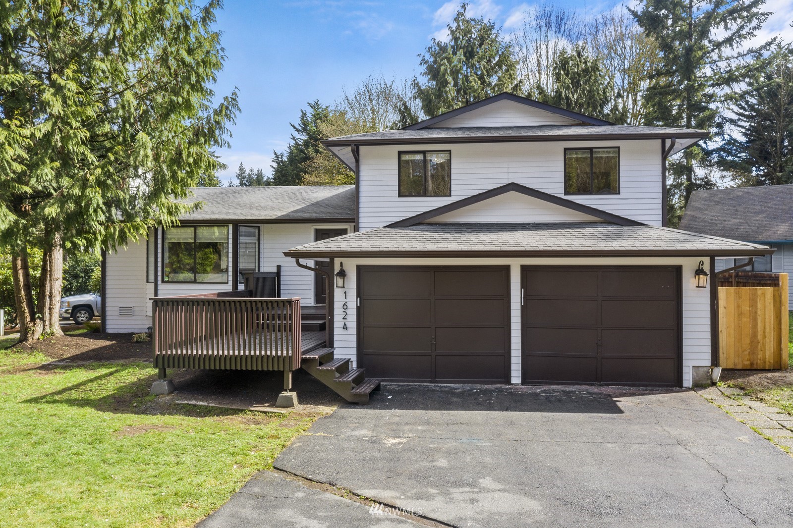 1624 174th Place Southeast Bothell, WA 98012 - Photo 1 of 36 a front view of a house with garden