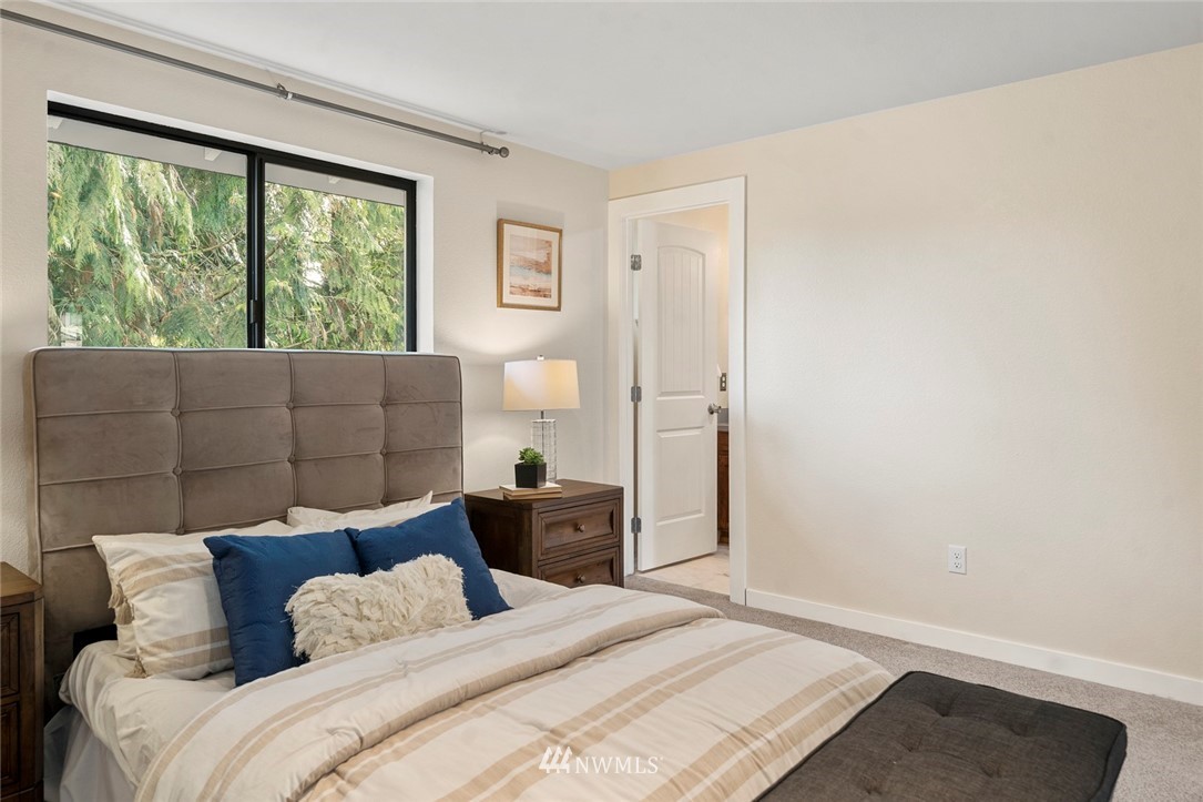 1624 174th Place Southeast Bothell, WA 98012 - Photo 21 of 36 a bedroom with a bed and a window