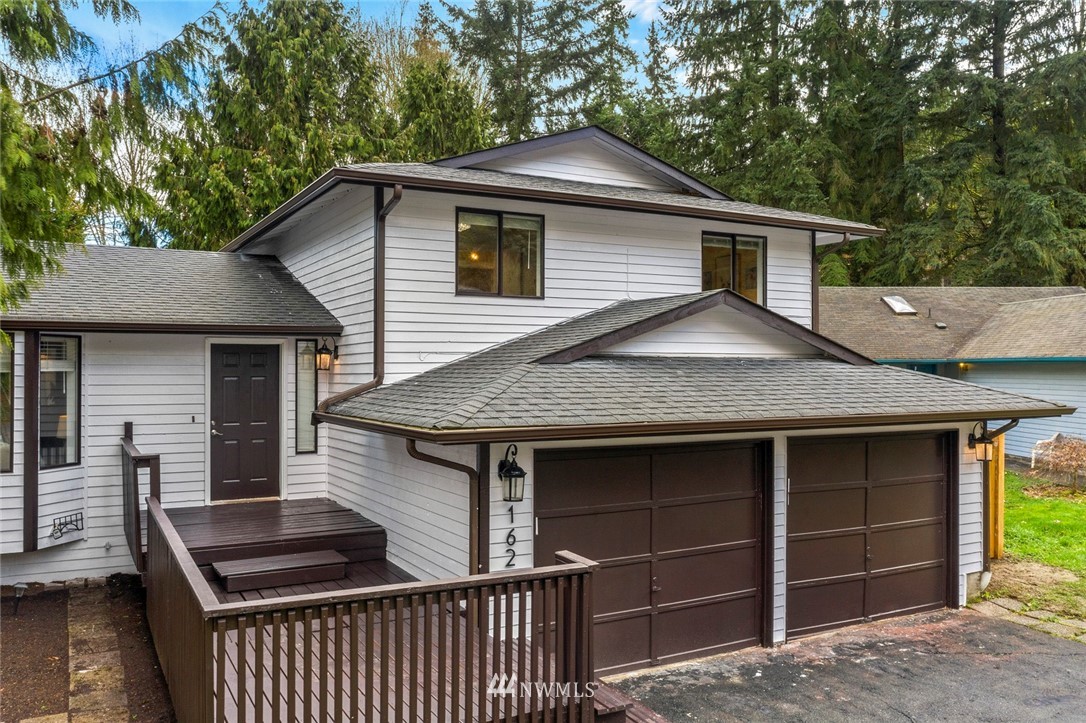 1624 174th Place Southeast Bothell, WA 98012 - Photo 28 of 36 a front view of a house with a balcony