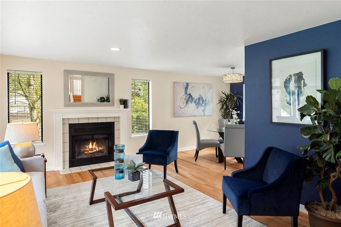 1624 174th Place Southeast Bothell, WA 98012 - Photo 4 of 36 a living room with furniture and a fireplace
