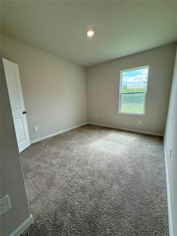 3222 Bitterroot Lane Bradenton, FL 34211 - Photo 28 of 34 an empty room with a window