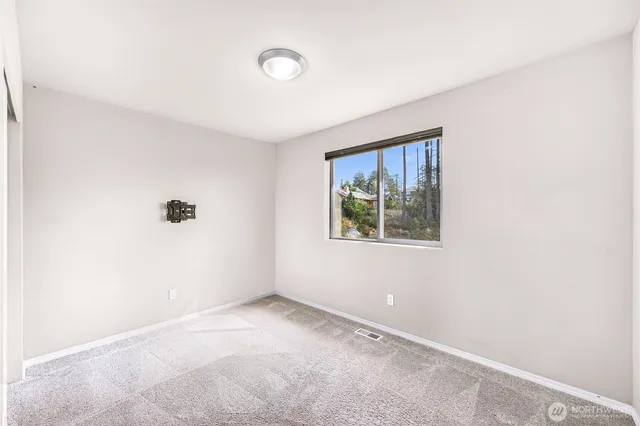 a view of empty room with windows