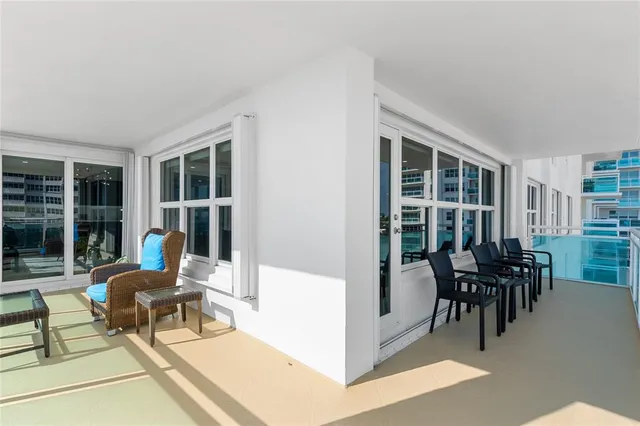 a view of an entryway with wooden floor and windows