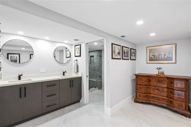 a large kitchen with stainless steel appliances lots of counter top space