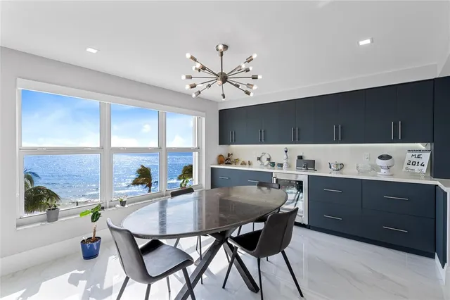 a kitchen with refrigerator cabinets and stainless steel appliances