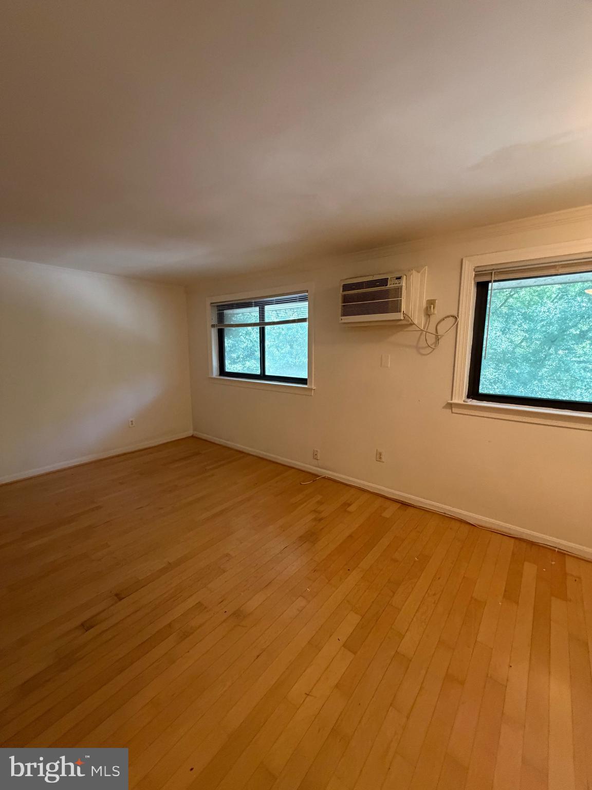 3107 Naylor Road Southeast, Unit 301 Washington, DC 20020 - Photo 10 of 19 an empty room with windows