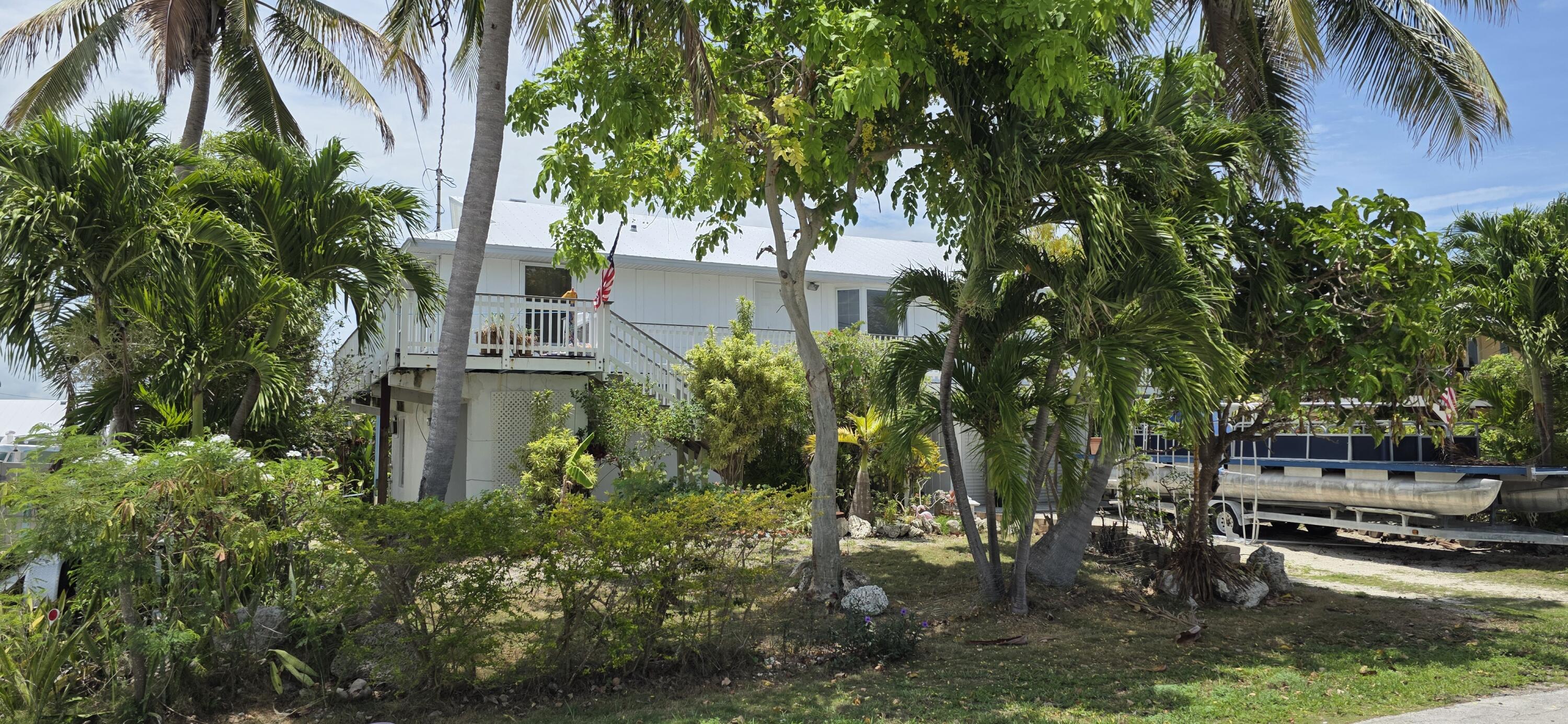 8 Emerald Drive Key West, FL 33040 - Photo 6 of 43 a backyard of a house with lots of green space