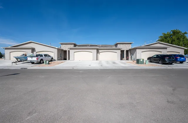 a view of a car parked in front of a house