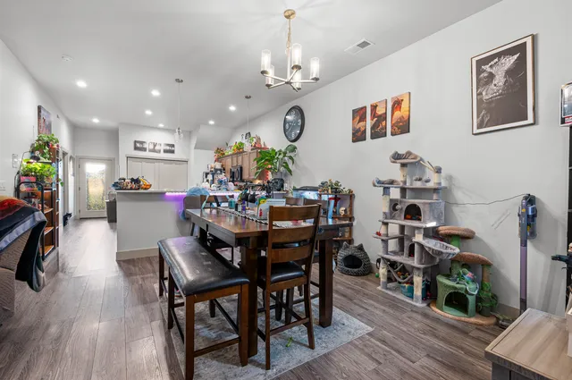 a view of a dining room with furniture and wooden floor