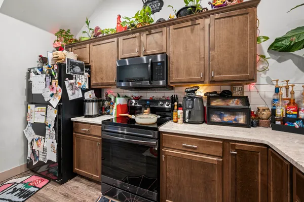 a kitchen with a stove and cabinets