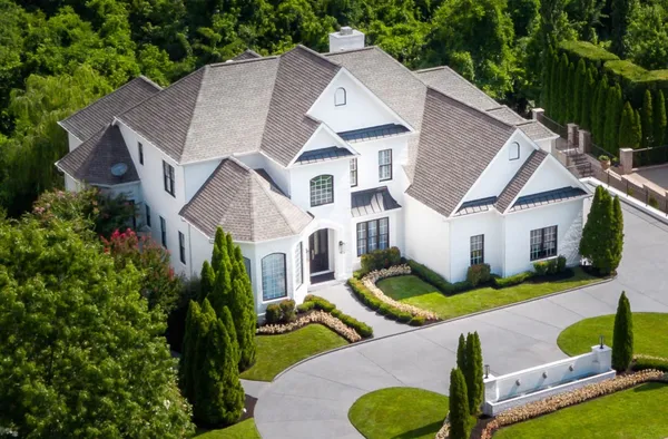 a view of a dining room with furniture wooden floor and chandelier