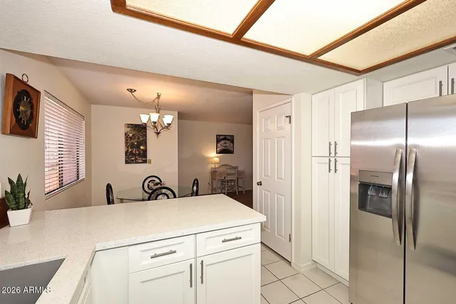 a en suite bathroom with a sink and a mirror