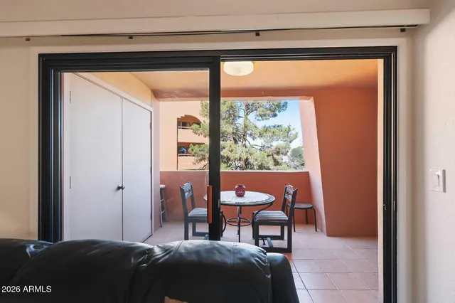 a room with furniture pool table and windows