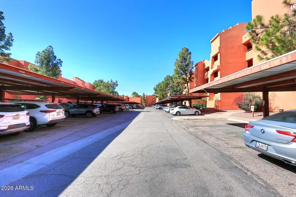 a view of street with parked cars