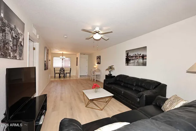 a view of a livingroom with furniture and window