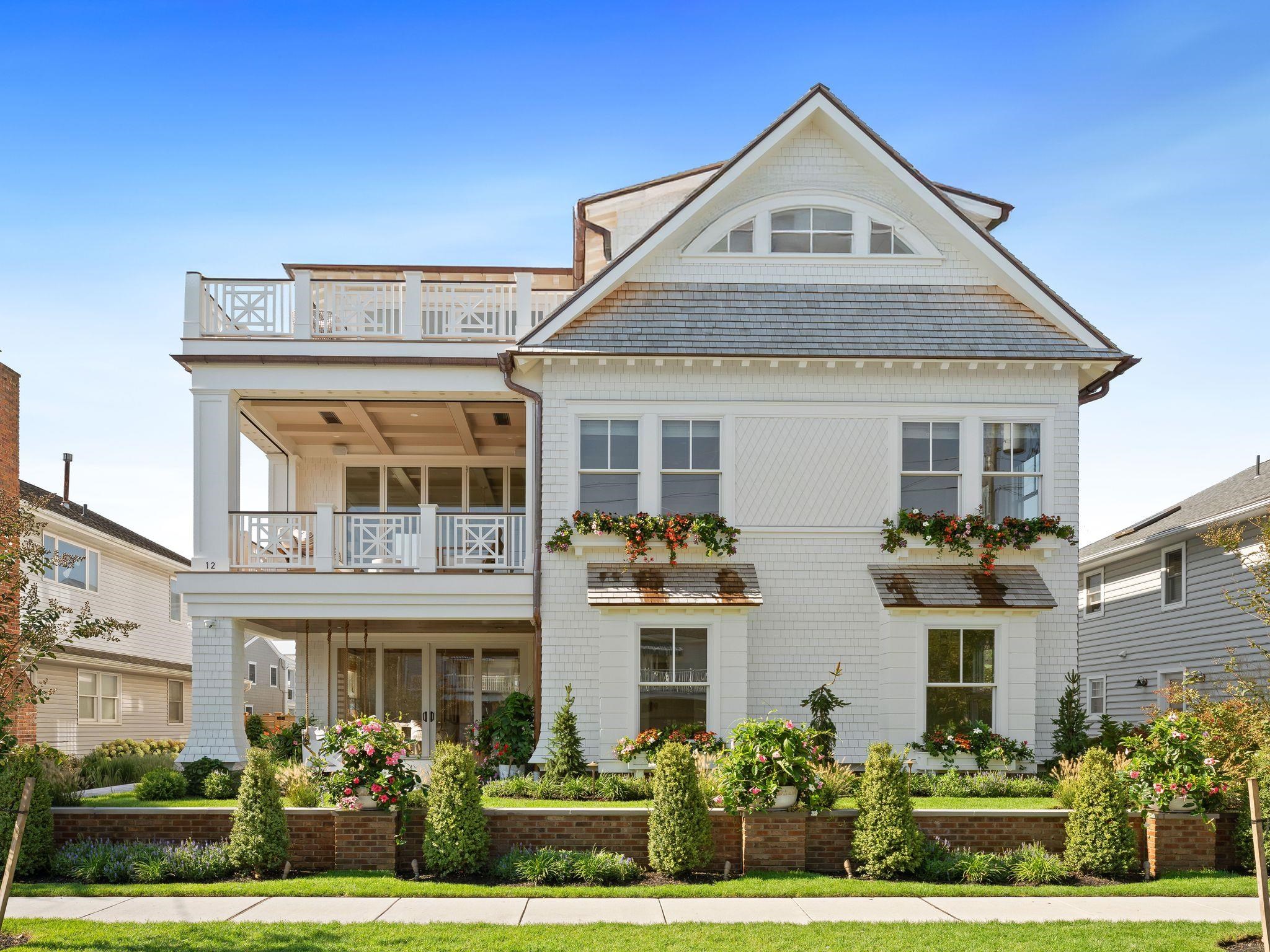 12 East Newcastle Road Ocean City, NJ 08226 - Photo 2 of 50 a front view of a house with a yard