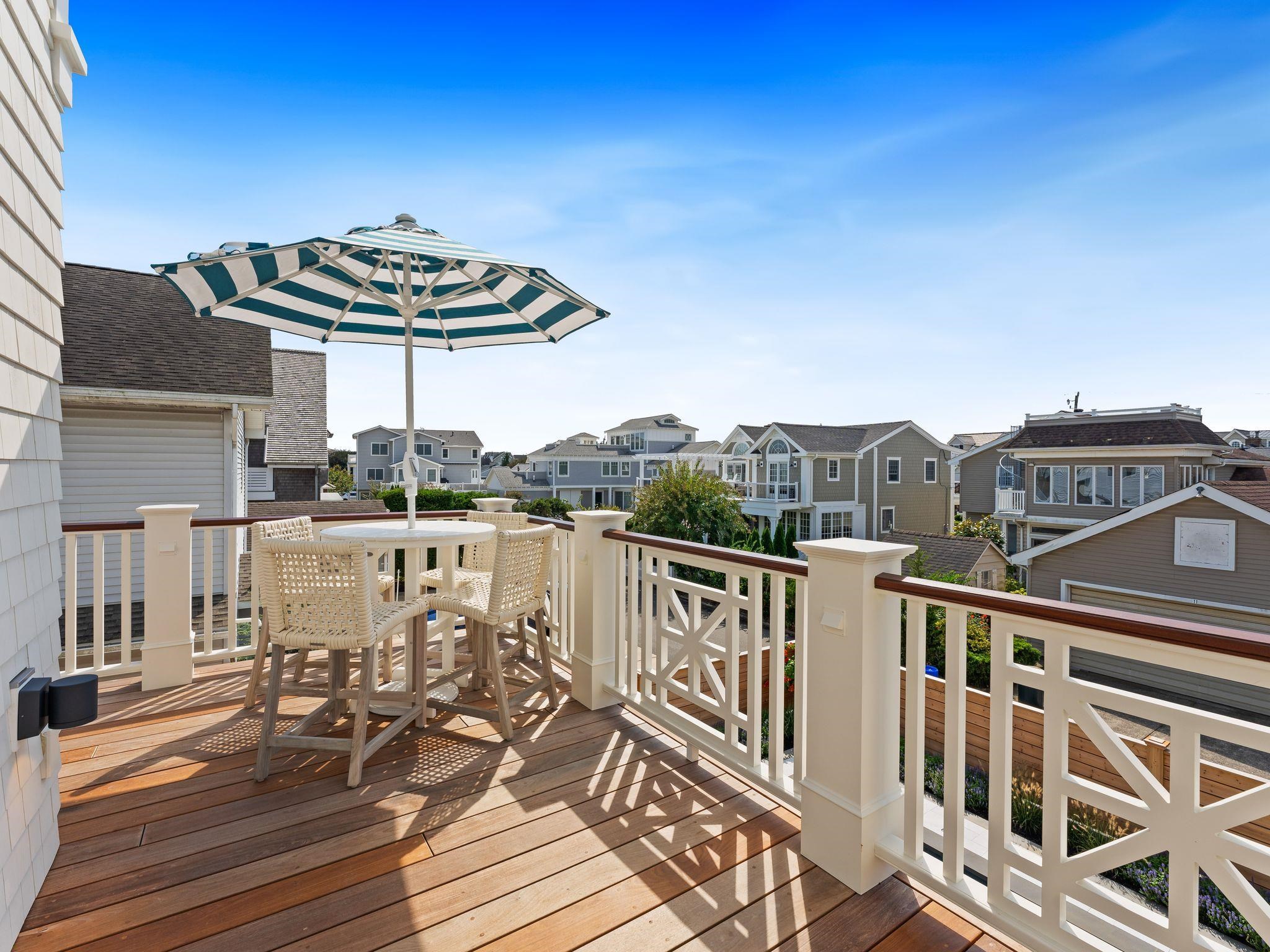 12 East Newcastle Road Ocean City, NJ 08226 - Photo 28 of 50 a view of a balcony with chairs