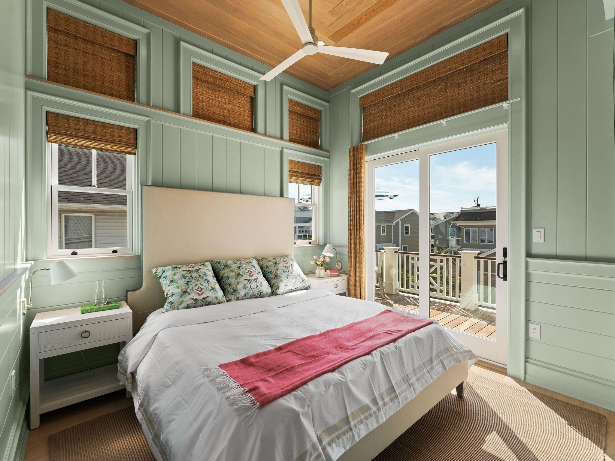 12 East Newcastle Road Ocean City, NJ 08226 - Photo 39 of 50 a bedroom with a large bed and a large window