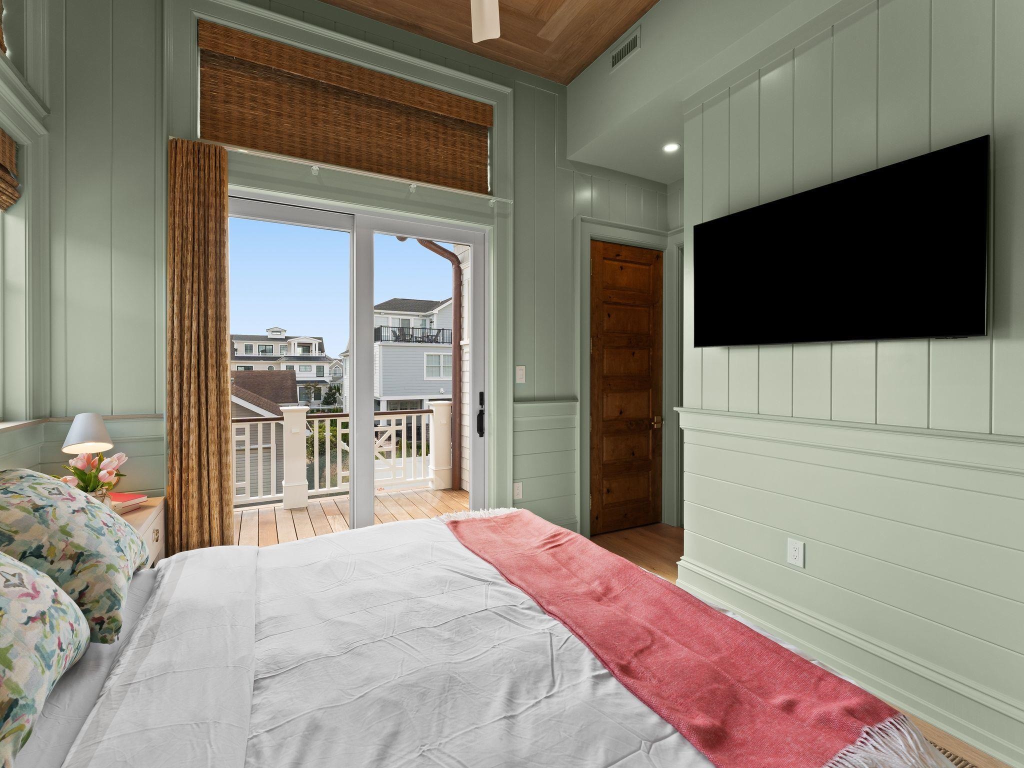 12 East Newcastle Road Ocean City, NJ 08226 - Photo 40 of 50 a bedroom with a bed and a flat screen tv