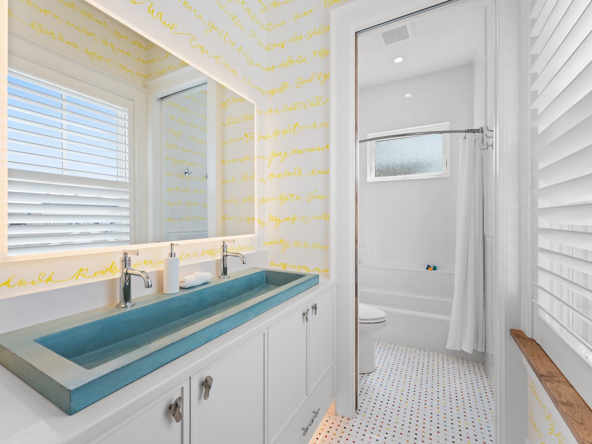 12 East Newcastle Road Ocean City, NJ 08226 - Photo 45 of 50 a bathroom with a granite countertop sink and a bathtub
