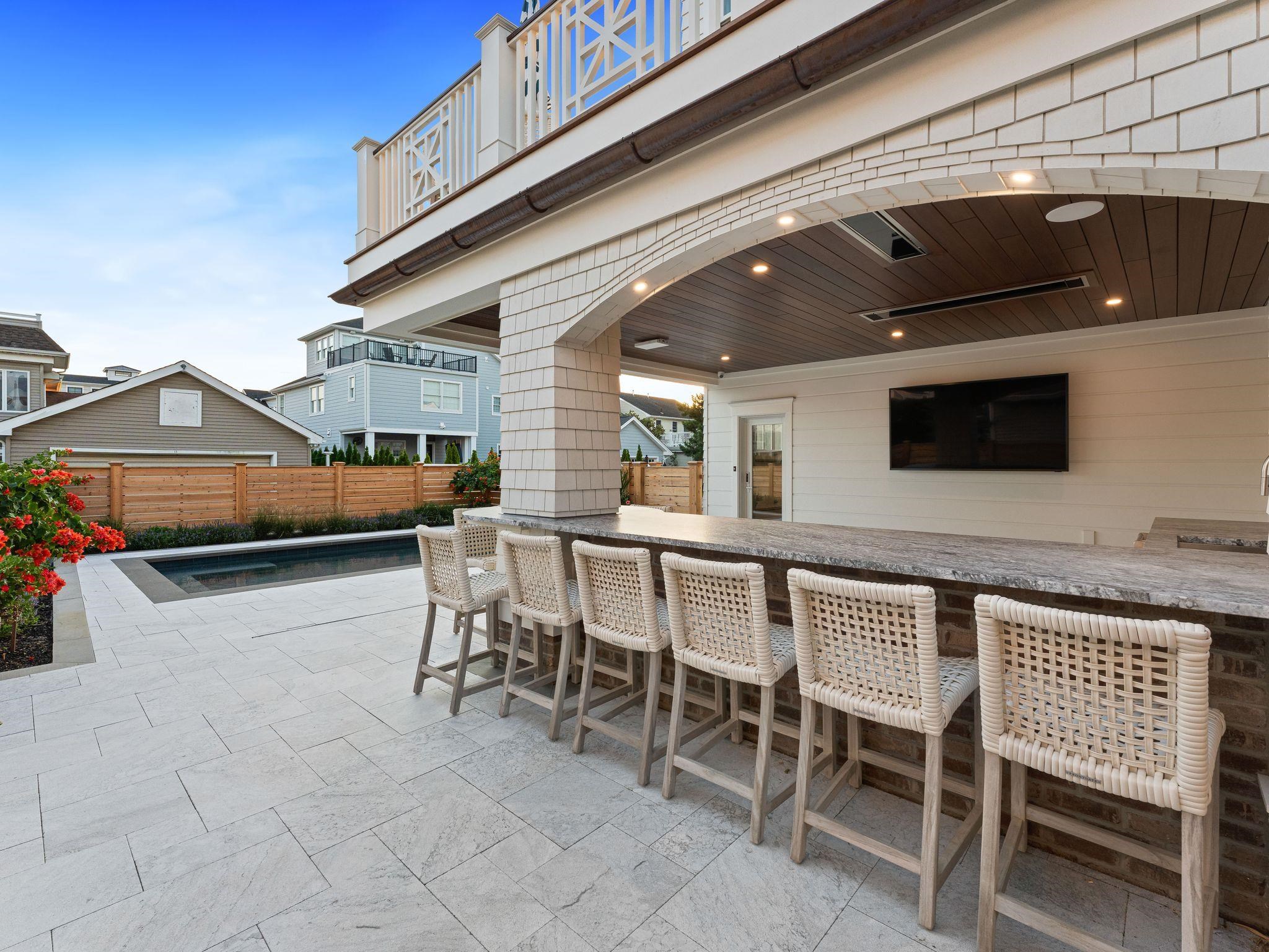 12 East Newcastle Road Ocean City, NJ 08226 - Photo 46 of 50 a patio with table and chairs