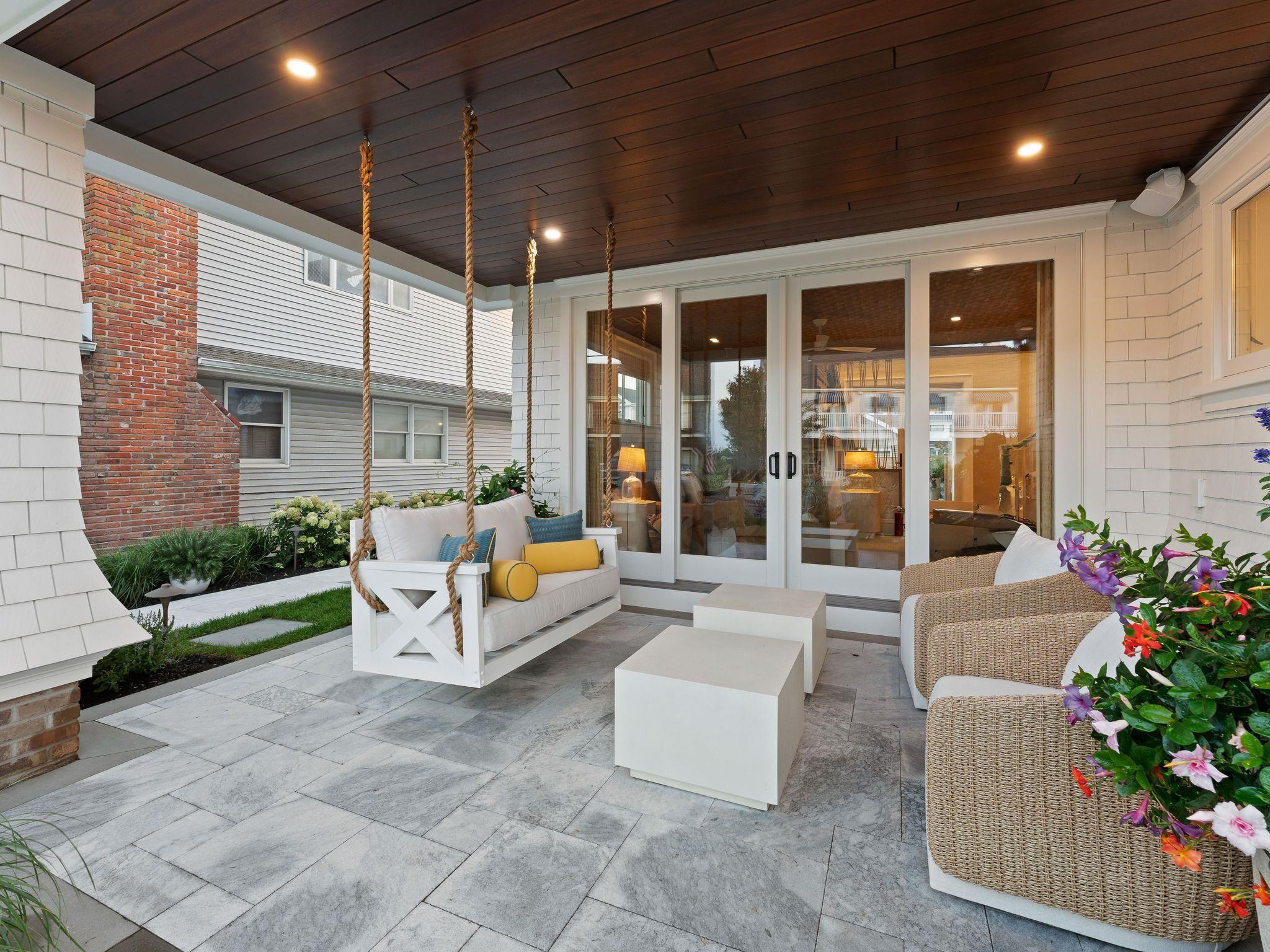 12 East Newcastle Road Ocean City, NJ 08226 - Photo 8 of 50 a building outdoor space with patio furniture and potted plants