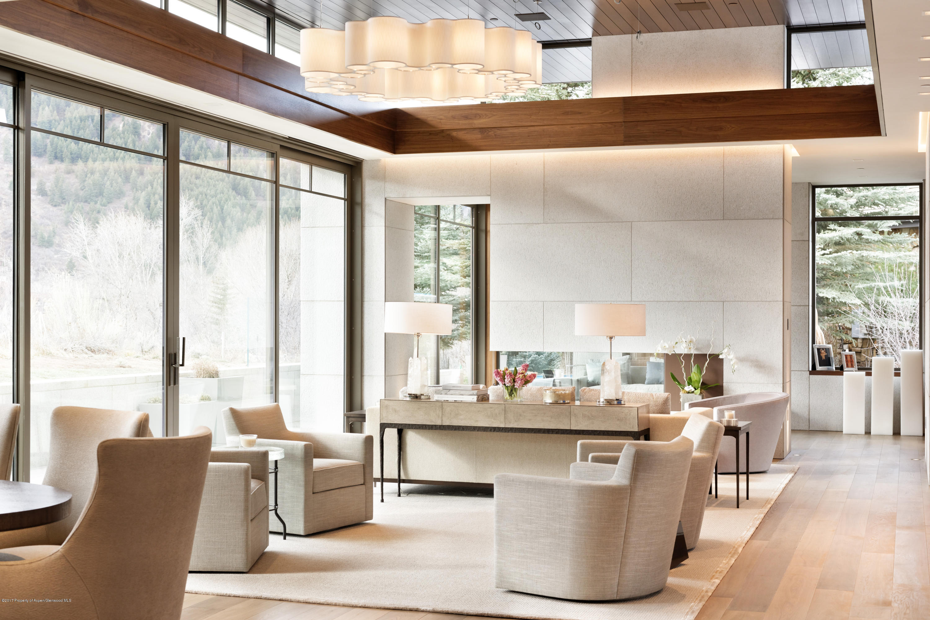 135 Miners Trail Road Aspen, CO 81611 - Photo 11 of 41 a dining room with furniture and large windows