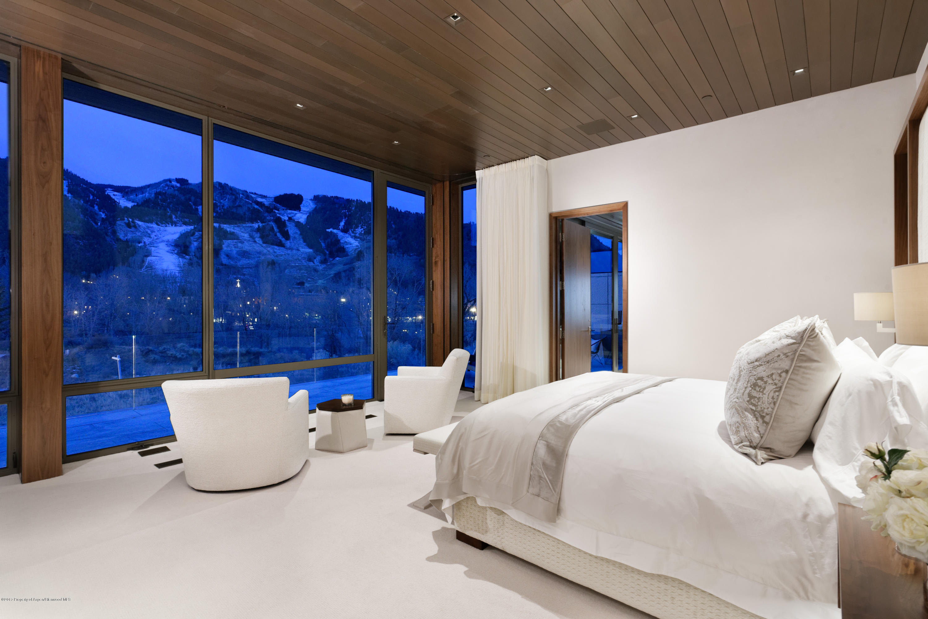 135 Miners Trail Road Aspen, CO 81611 - Photo 25 of 41 a bedroom with a bed and a lamp