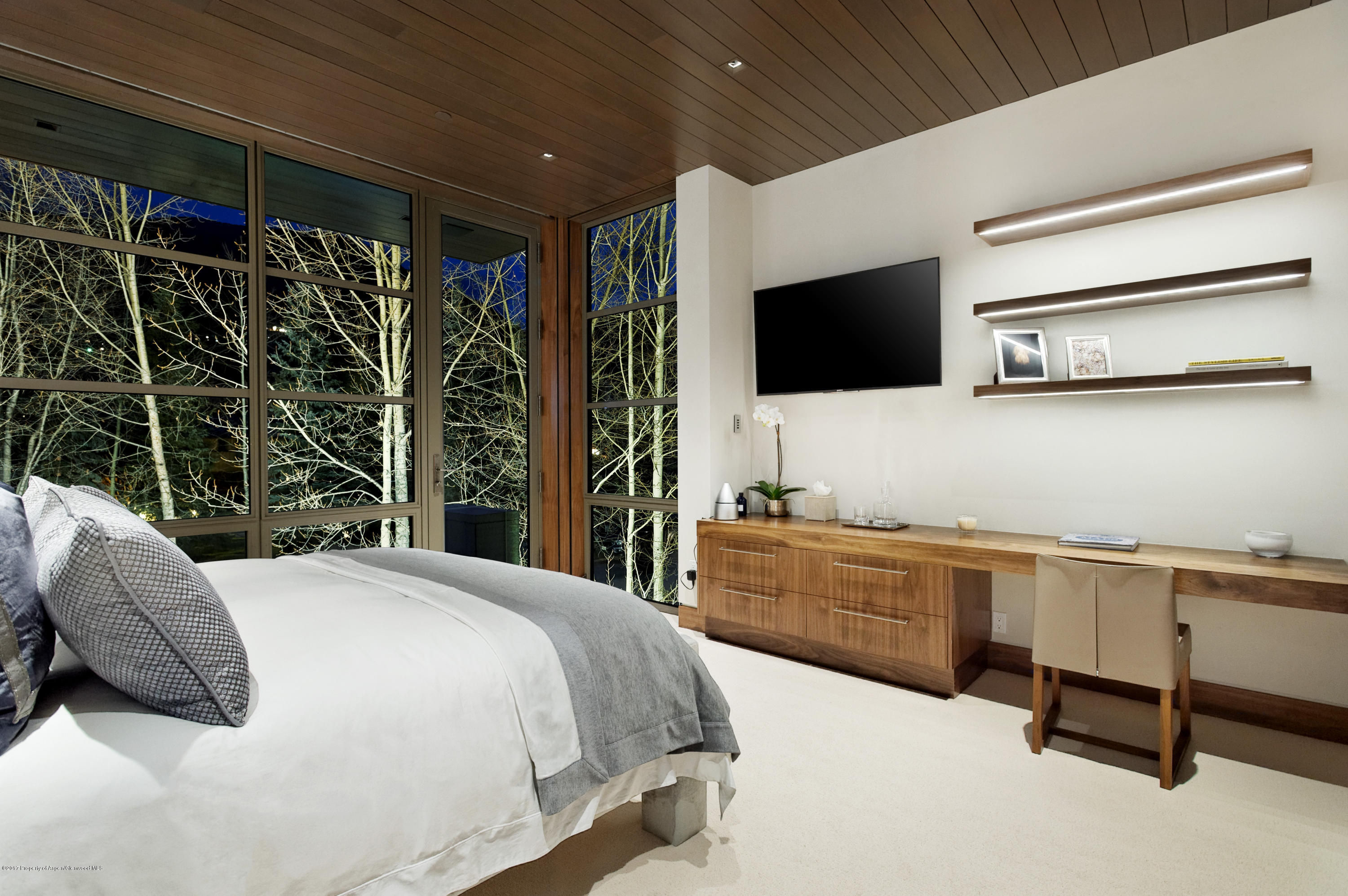 135 Miners Trail Road Aspen, CO 81611 - Photo 28 of 41 a spacious bedroom with a bed and a flat screen tv