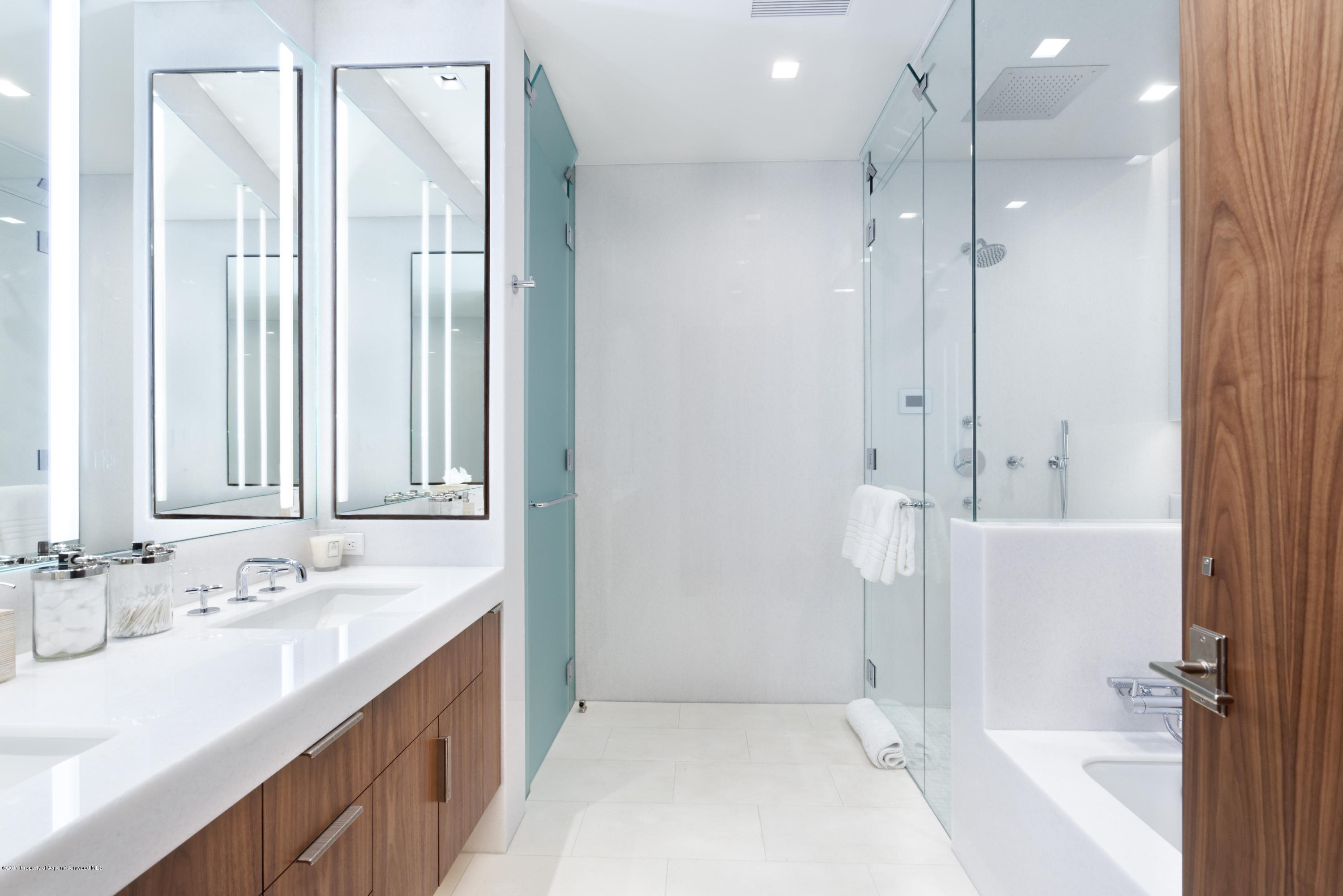 135 Miners Trail Road Aspen, CO 81611 - Photo 38 of 41 a bathroom with a double vanity sink a mirror and a bathtub