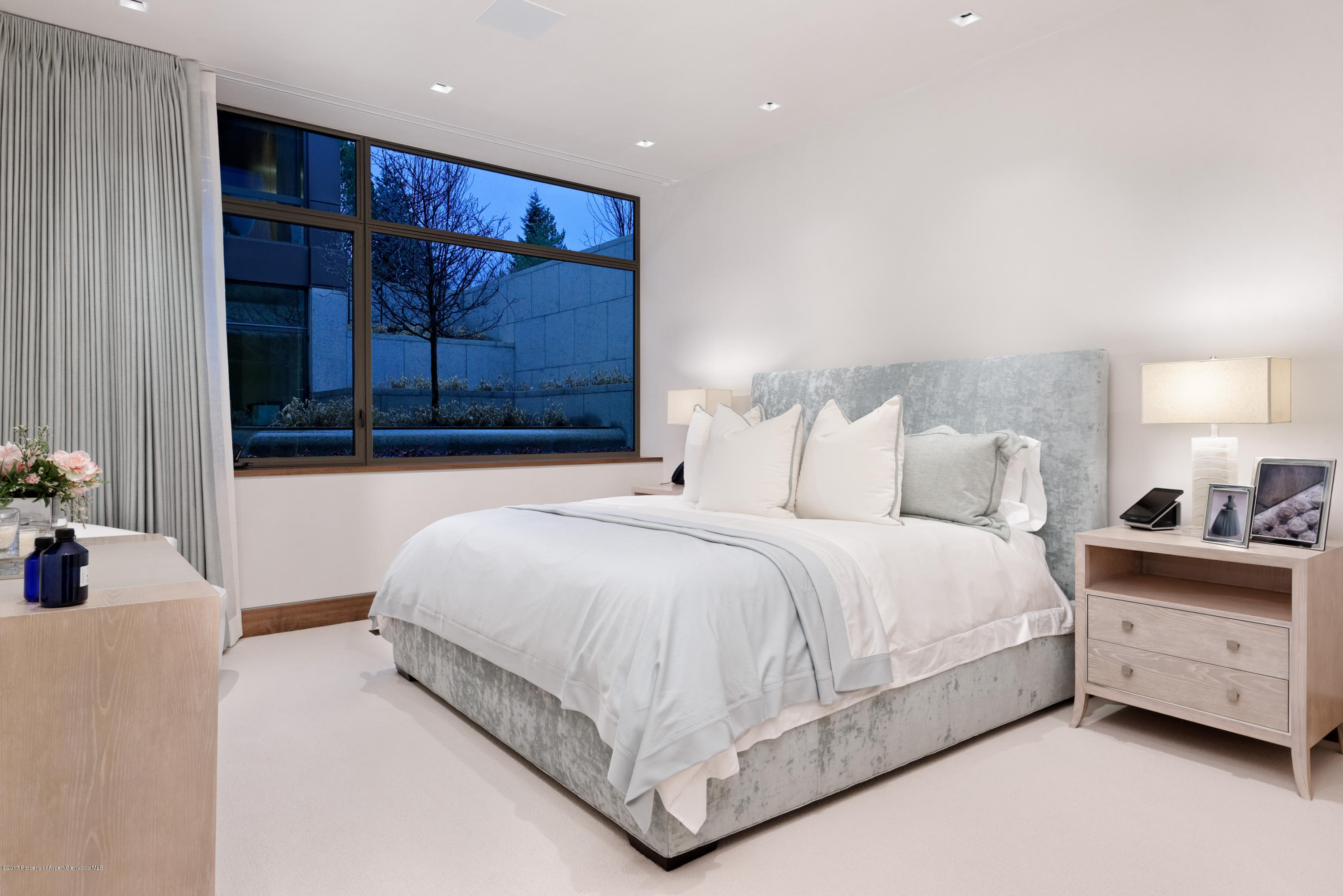 135 Miners Trail Road Aspen, CO 81611 - Photo 40 of 41 a bedroom with a bed and a window