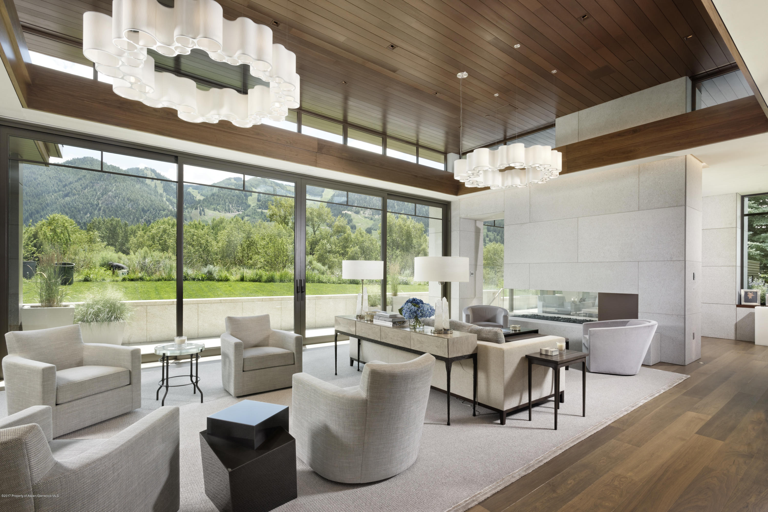 135 Miners Trail Road Aspen, CO 81611 - Photo 4 of 41 a living room with patio furniture and a floor to ceiling window