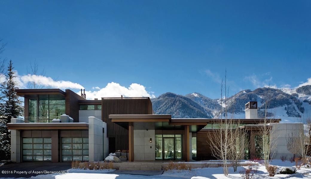 135 Miners Trail Road Aspen, CO 81611 - Photo 7 of 41 a front view of a house with a garden