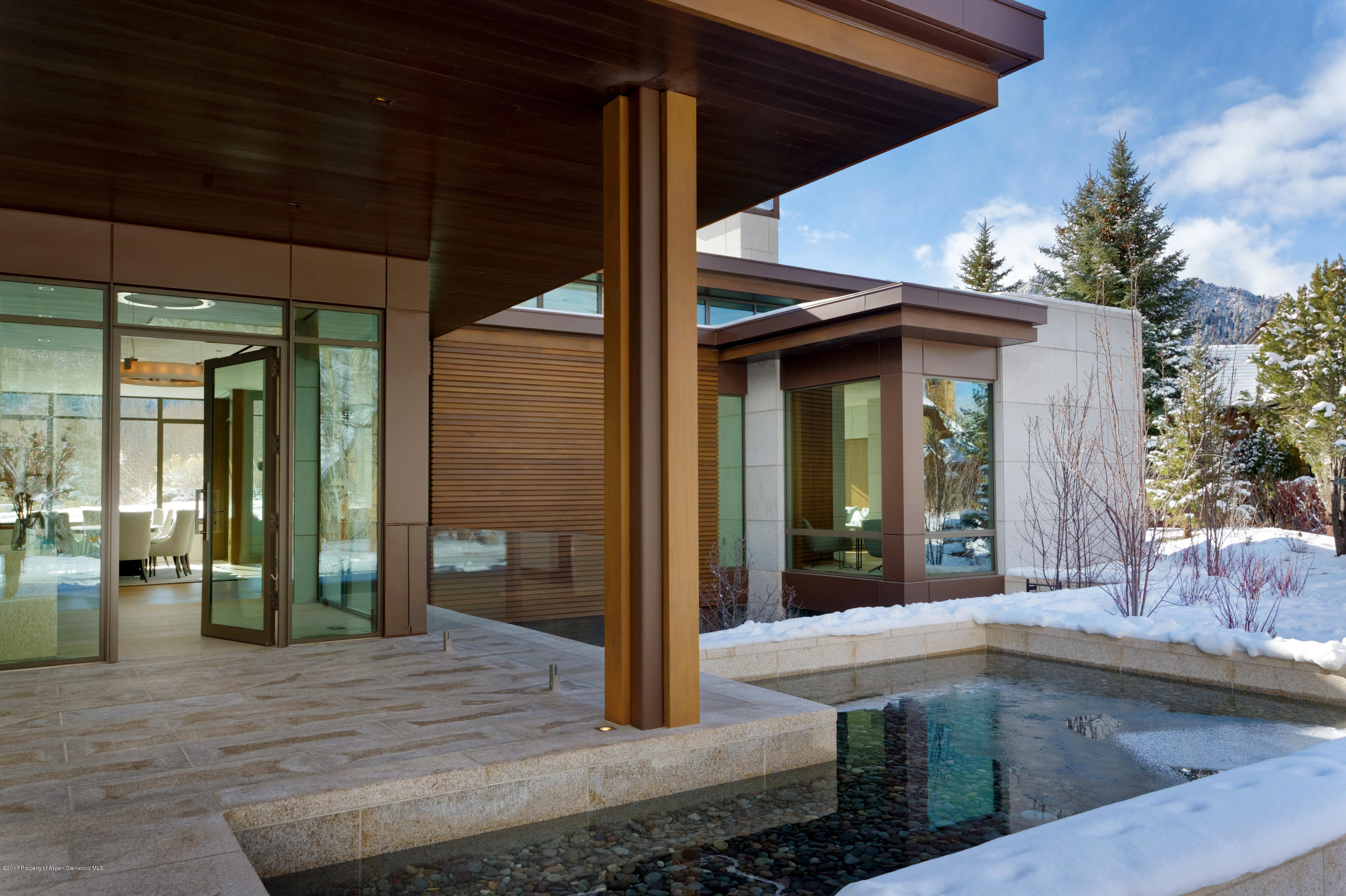 135 Miners Trail Road Aspen, CO 81611 - Photo 9 of 41 a view of a house with a patio