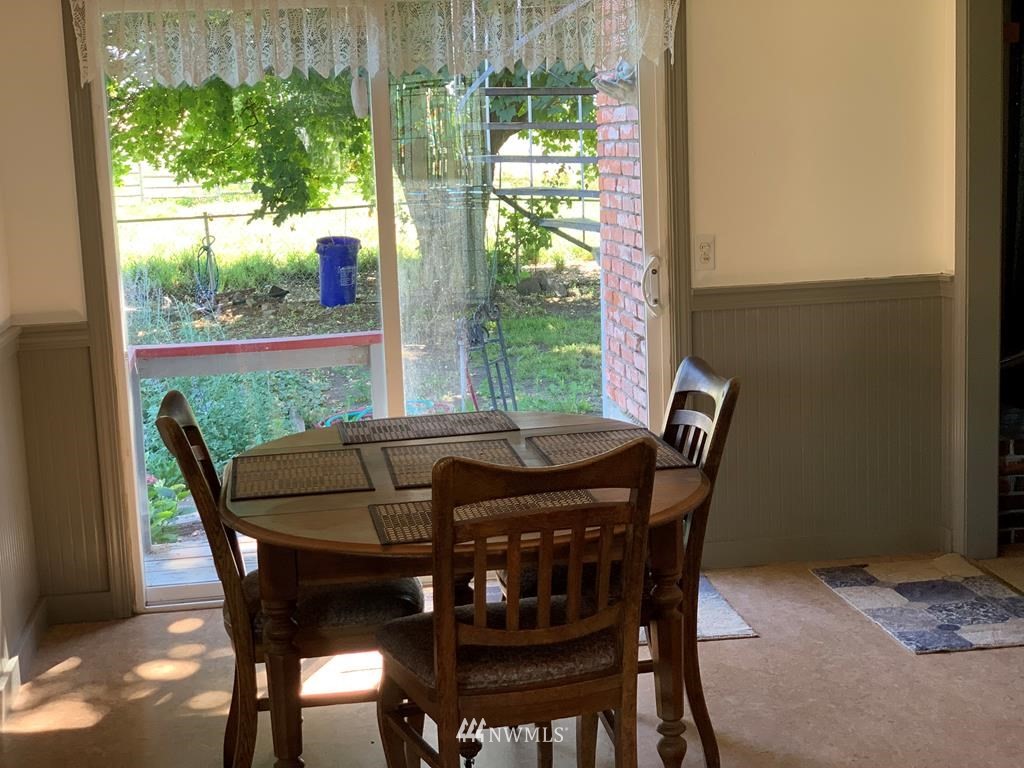 141 Rogers Road Prescott, WA 99348 - Photo 11 of 40 a view of a dining room with furniture and window