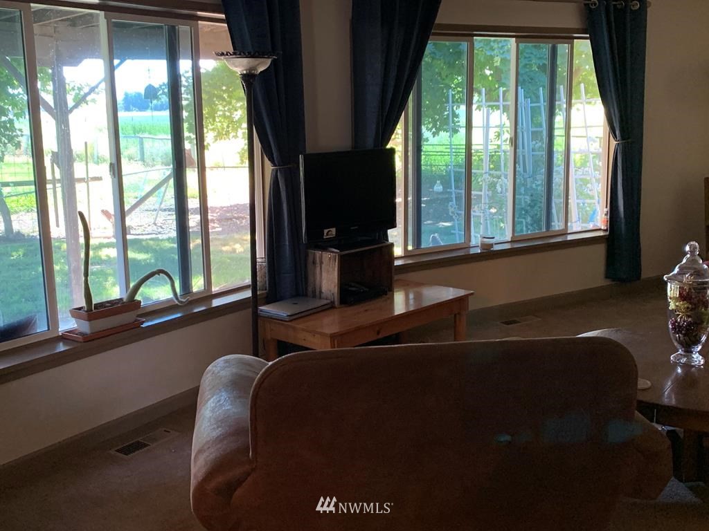 141 Rogers Road Prescott, WA 99348 - Photo 14 of 40 a room with a large window and bed