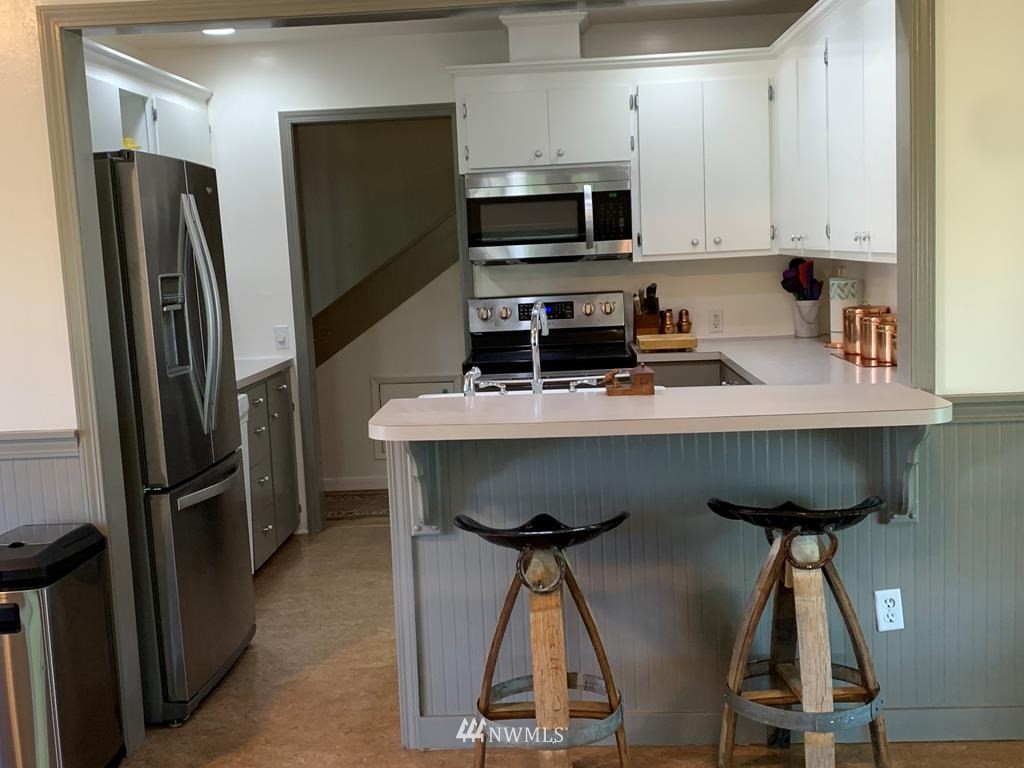 141 Rogers Road Prescott, WA 99348 - Photo 6 of 40 a kitchen with stainless steel appliances a stove a refrigerator and a sink