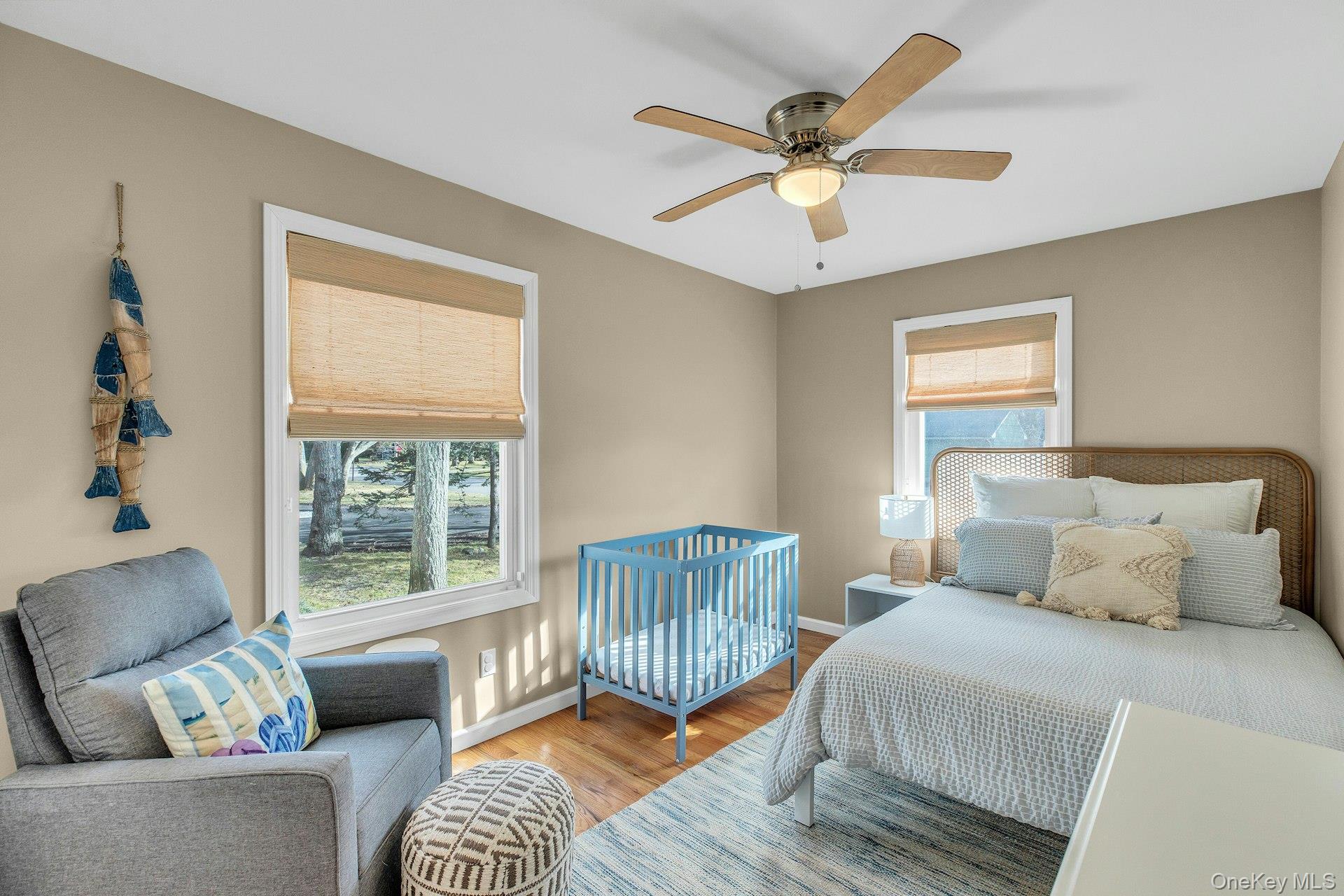 79 School Street Hampton Bays, NY 11946 - Photo 14 of 49 a bedroom with a bed and a window