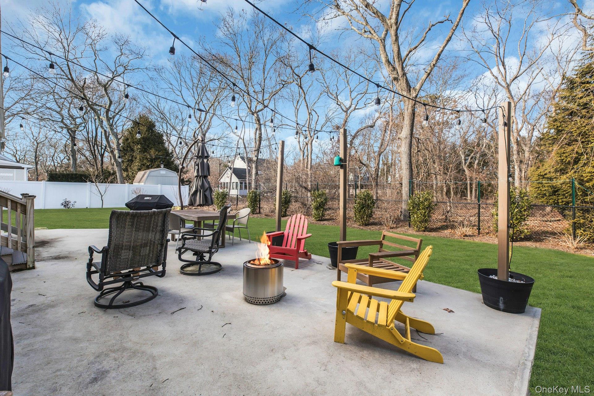 79 School Street Hampton Bays, NY 11946 - Photo 29 of 49 a view of a bench in a backyard