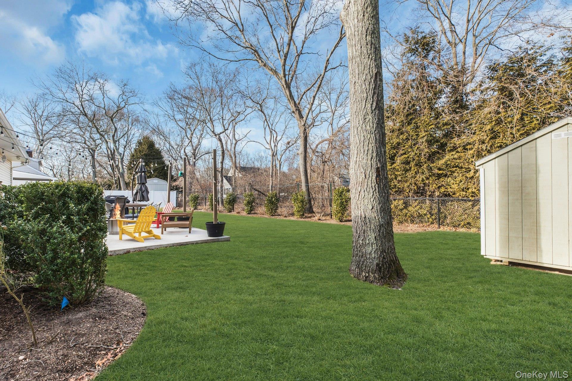 79 School Street Hampton Bays, NY 11946 - Photo 30 of 49 a view of yard with swimming pool and sitting area