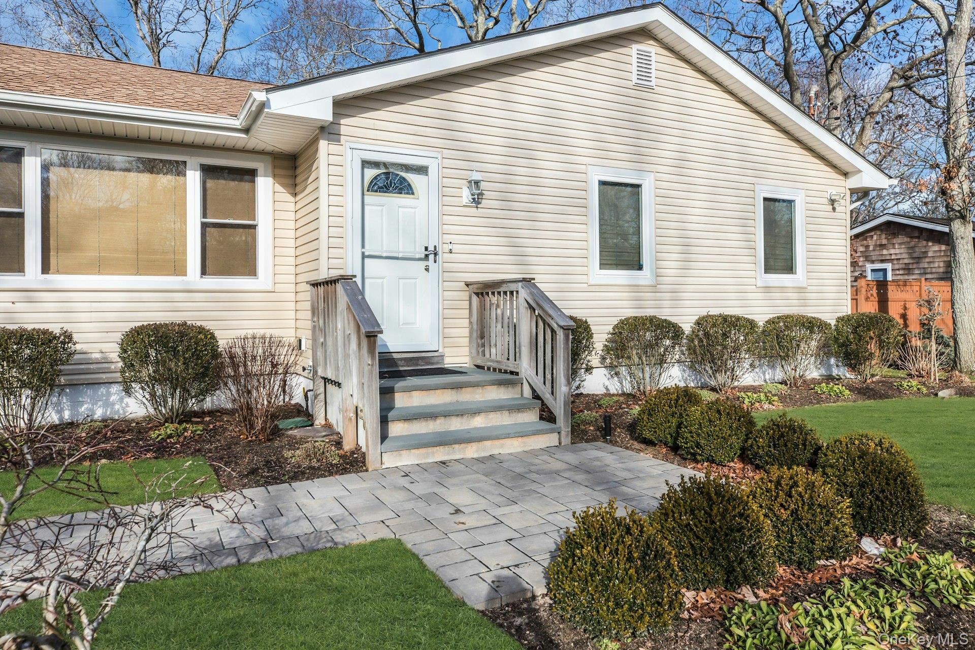 79 School Street Hampton Bays, NY 11946 - Photo 3 of 49 a view of a house with backyard and trees