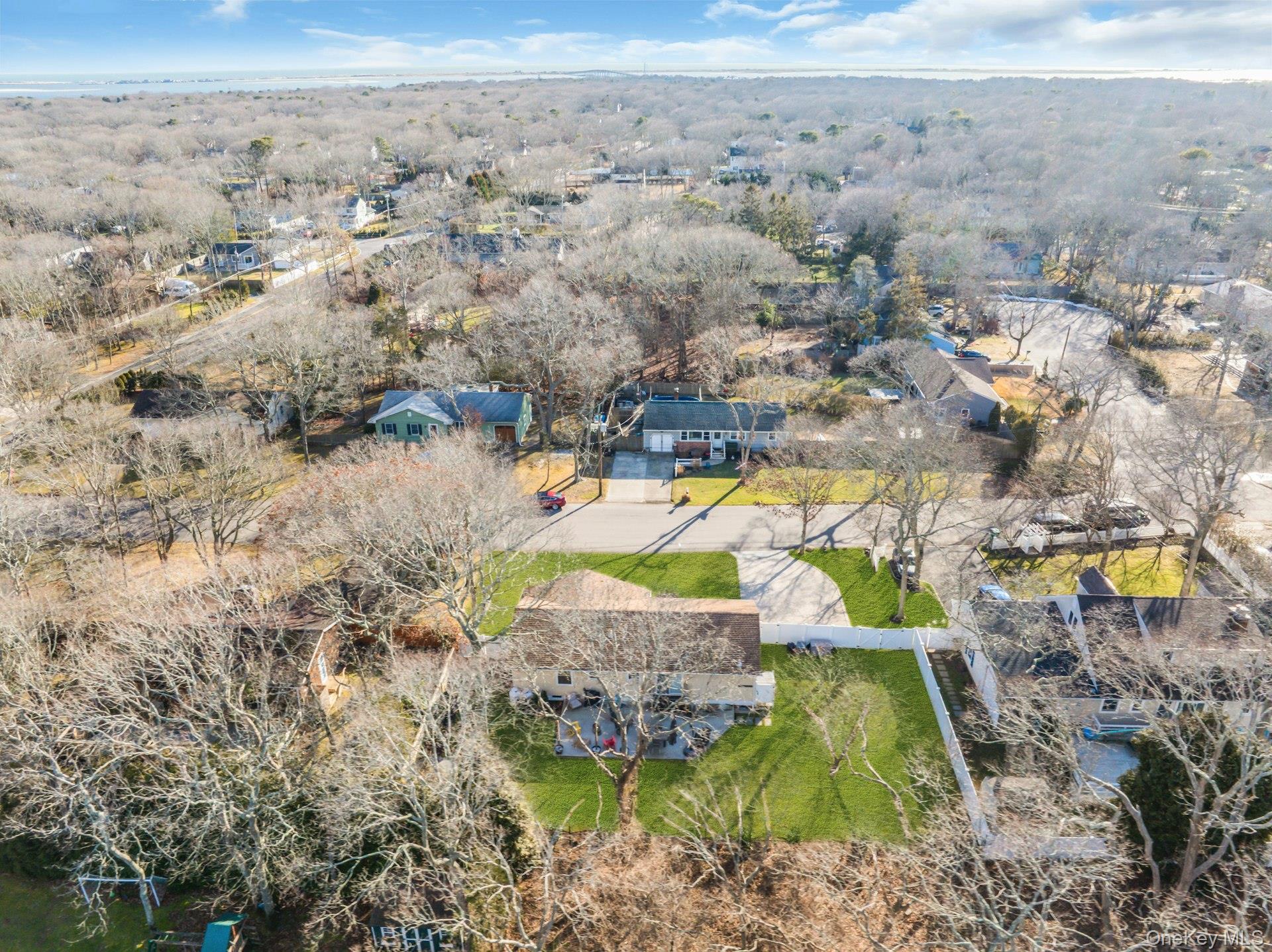 79 School Street Hampton Bays, NY 11946 - Photo 36 of 49 an aerial view of a house with a swimming pool