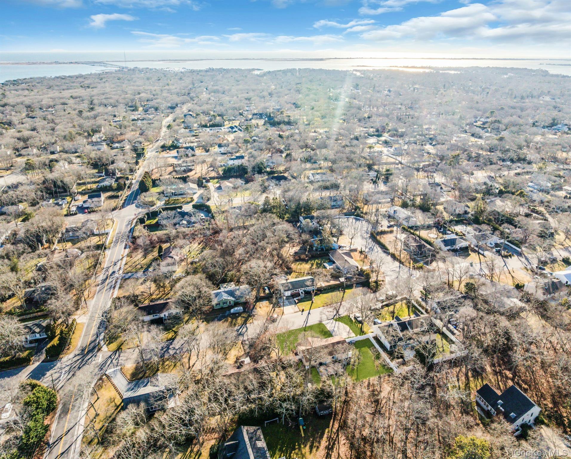 79 School Street Hampton Bays, NY 11946 - Photo 45 of 49 an aerial view of residential houses with outdoor space