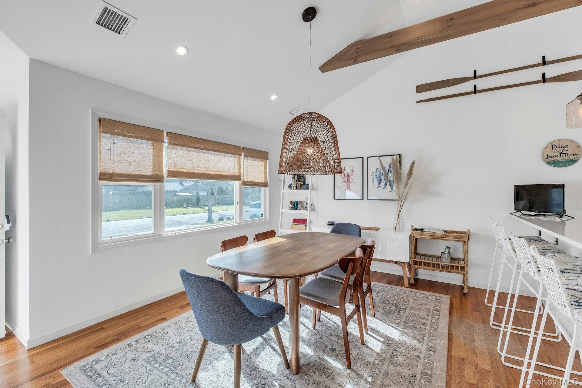 79 School Street Hampton Bays, NY 11946 - Photo 5 of 49 a view of a dining room with furniture window and wooden floor
