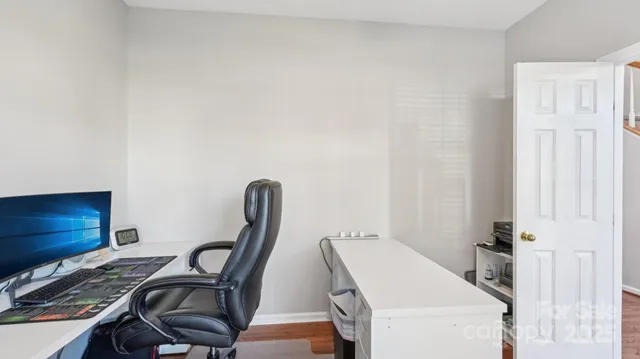 a view of a room with furniture and a window