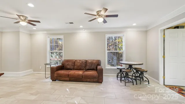 a living room with furniture and a window